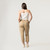 Full body back view of model wearing 100% organic cotton surplus pant in color khaki.