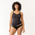 Close up front view of model wearing organic Cotton Women's Low-Rise Bikini in color black.