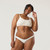 Close up front view of model wearing organic Cotton Women's Low-Rise Bikini in color natural.
