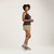Full body side view of model wearing 100% Regenerative Organic Certified® Cotton  Classic Tank in pepper.