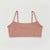 Flat lay of organic cotton strappy bralette in color clay.