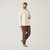 Full body side view of model wearing organic cotton waffle henley in color natural.