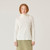 Close up front view of model wearing organic cotton turtleneck in color natural.