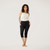 Model wearing black solid color organic cotton mid calf blackout leggings shown from the front.