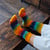 Lifestyle photo of organic cotton socks hand dyed crew bold on models feet.