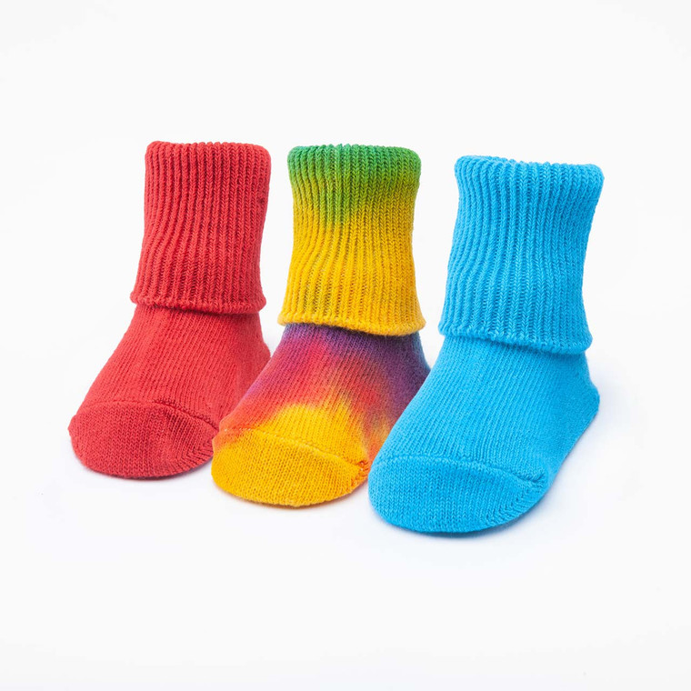 Red solid color, tie-dyed colorful, and bright blue solid color organic cotton baby anklet socks. Pack of three.