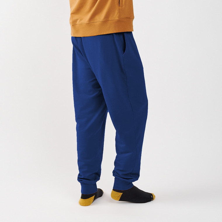 Side view of model wearing Unisex Fleece Jogger in eclipse color