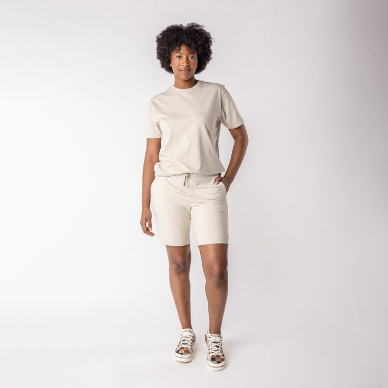 Full body view of model wearing sweat short in pearl.