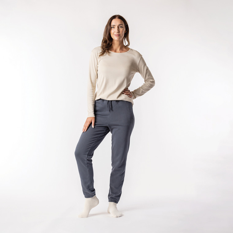 Full body view of model wearing organic cotton classic sweatpant in infinity blue.