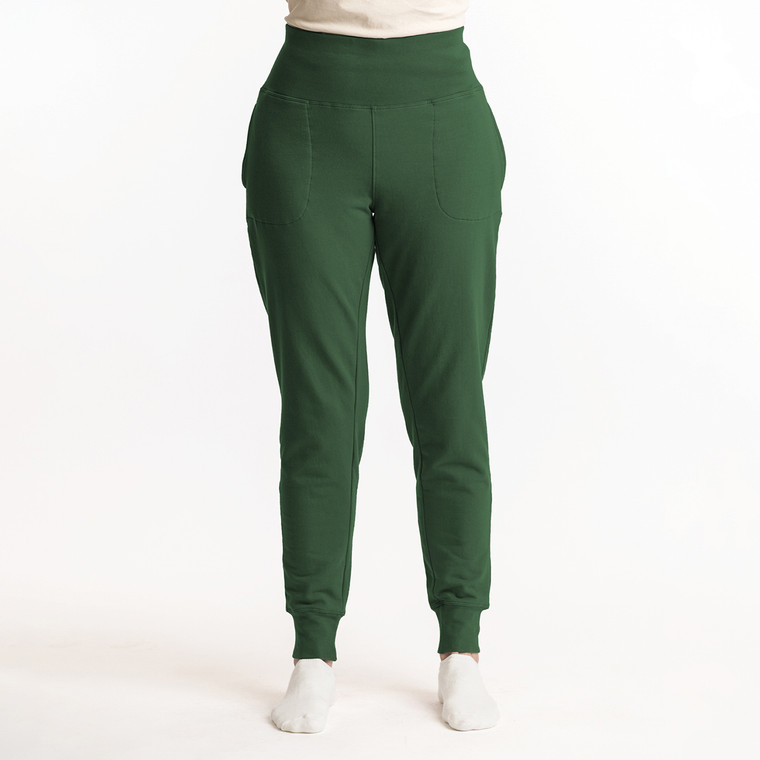 Front view of model wearing organic cotton fleece jogger in pine