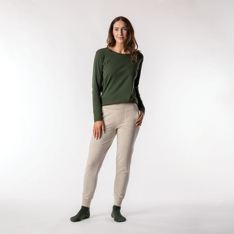 Full body front view of model wearing organic cotton layering tee in color pine