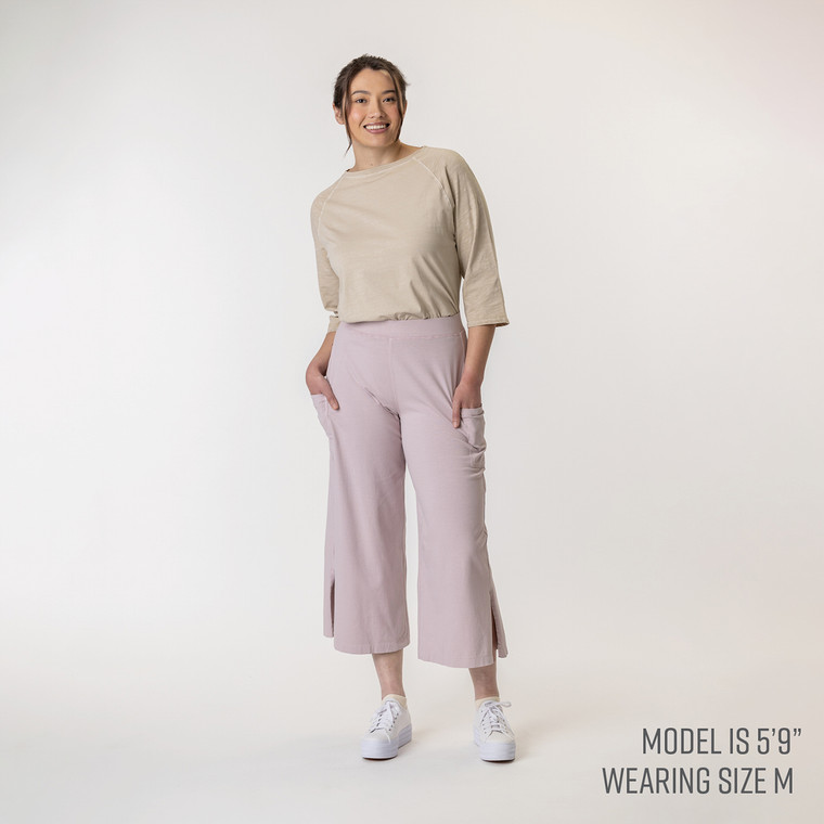 Full body view of model wearing organic cotton gaucho pant in color lavender.