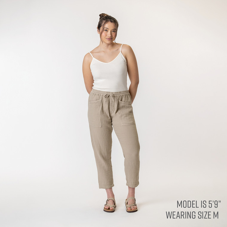 Full body front view of model wearing organic cotton harem pant in color putty.