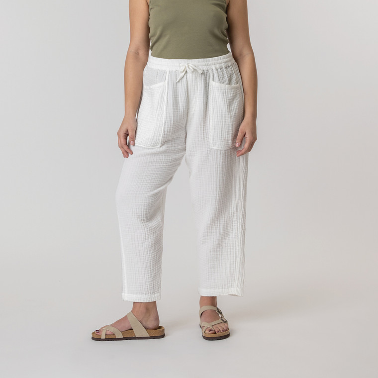Close up front view of model wearing organic cotton harem pant in color salt.