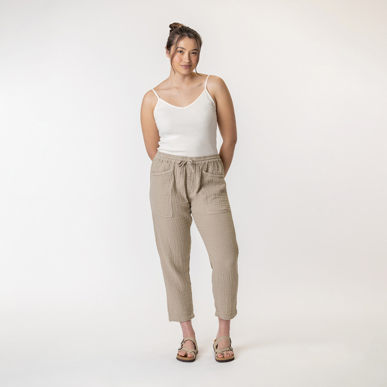 Full body front view of model wearing organic cotton harem pant in color putty.