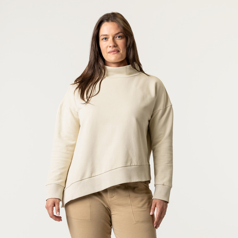 Front view of model wearing 100% Regenerative Organic Certified® Cotton Funnel Neck Top in color pearl.