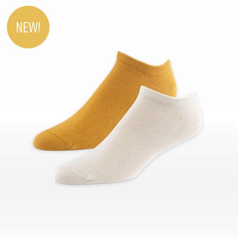 Foot form photo of organic cotton footie socks 2 pack in color gold and natural.