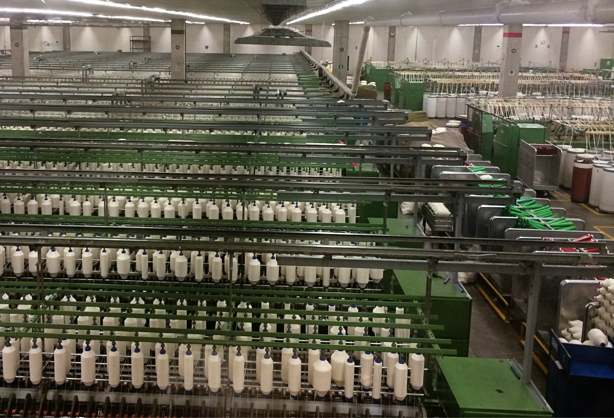 Spinning organic cotton fiber into yarn for Maggie's Organics socks