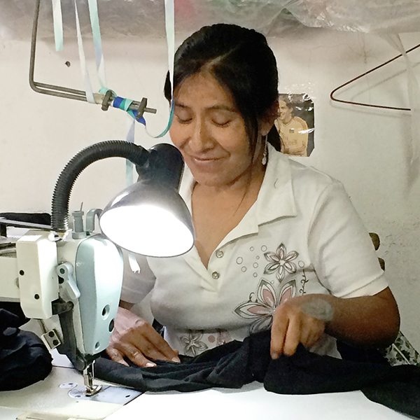 Trade union worker sewing Maggie's leggings.